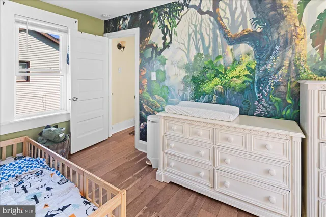 a bathroom with a sink a mirror and shower