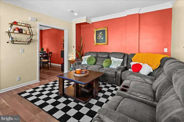 a living room with furniture and rug floor