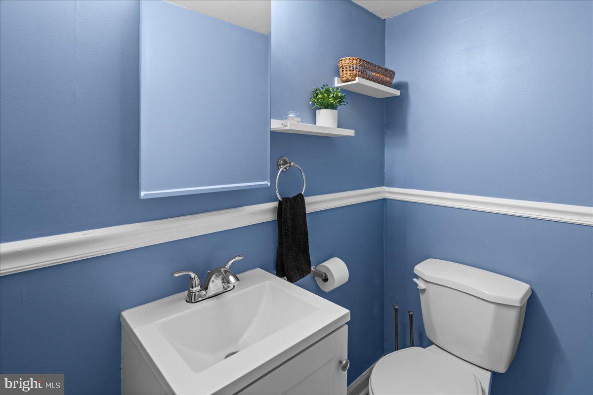 48 Homestead Avenue Ewing, NJ 08638 - Photo 9 of 21 a bathroom with a toilet sink and mirror