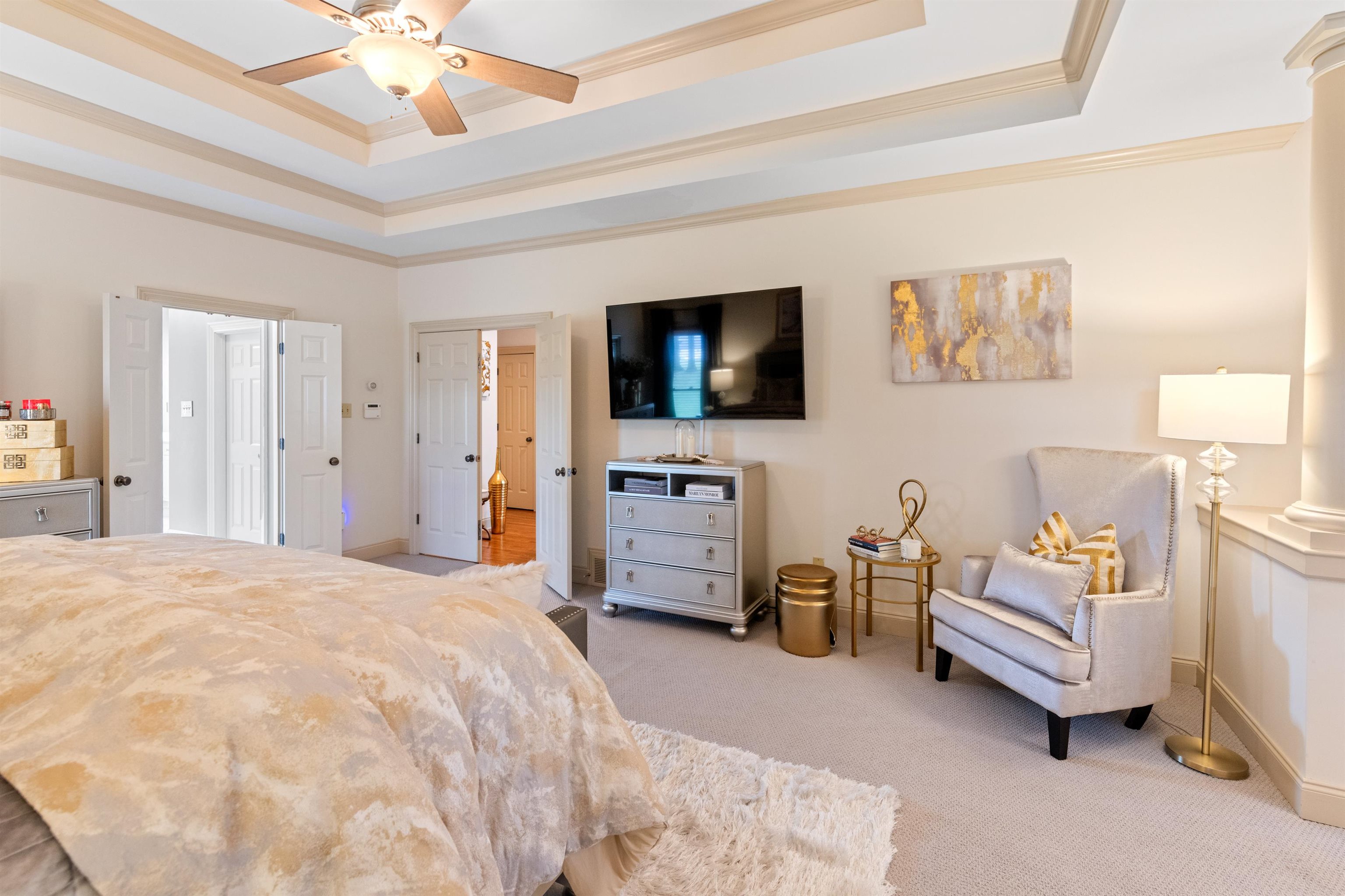11241 Latting Road Eads, TN 38028 - Photo 18 of 31 Bedroom featuring ornamental molding, a raised ceiling, ceiling fan, and light colored carpet