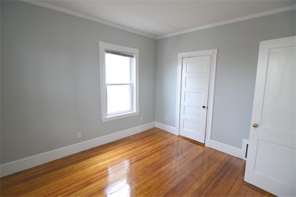 104 King Street, Unit 2 Boston, MA 02122 - Photo 15 of 29 a view of empty room with wooden floor and fan