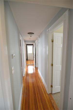 104 King Street, Unit 2 Boston, MA 02122 - Photo 16 of 29 a view of a hallway with wooden floor and staircase