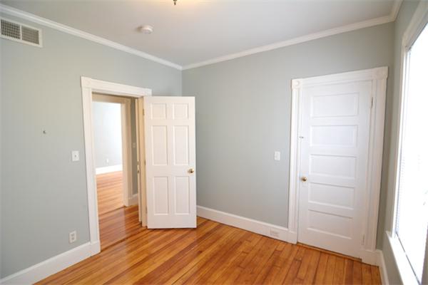 104 King Street, Unit 2 Boston, MA 02122 - Photo 20 of 29 an empty room with wooden floor and closet