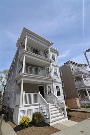 104 King Street, Unit 2 Boston, MA 02122 - Photo 26 of 29 a view of a big building with many windows