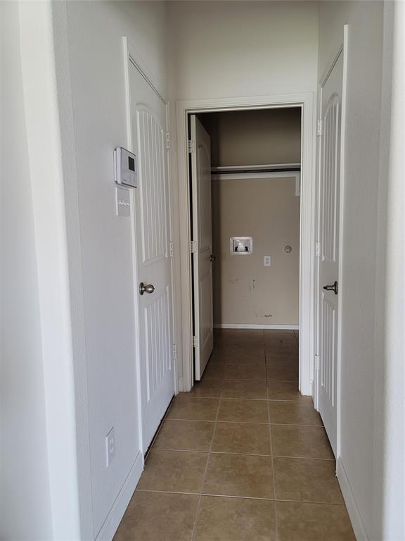 121 Chalk Road Anna, TX 75409 - Photo 11 of 22 a view of a hallway with wooden shelves