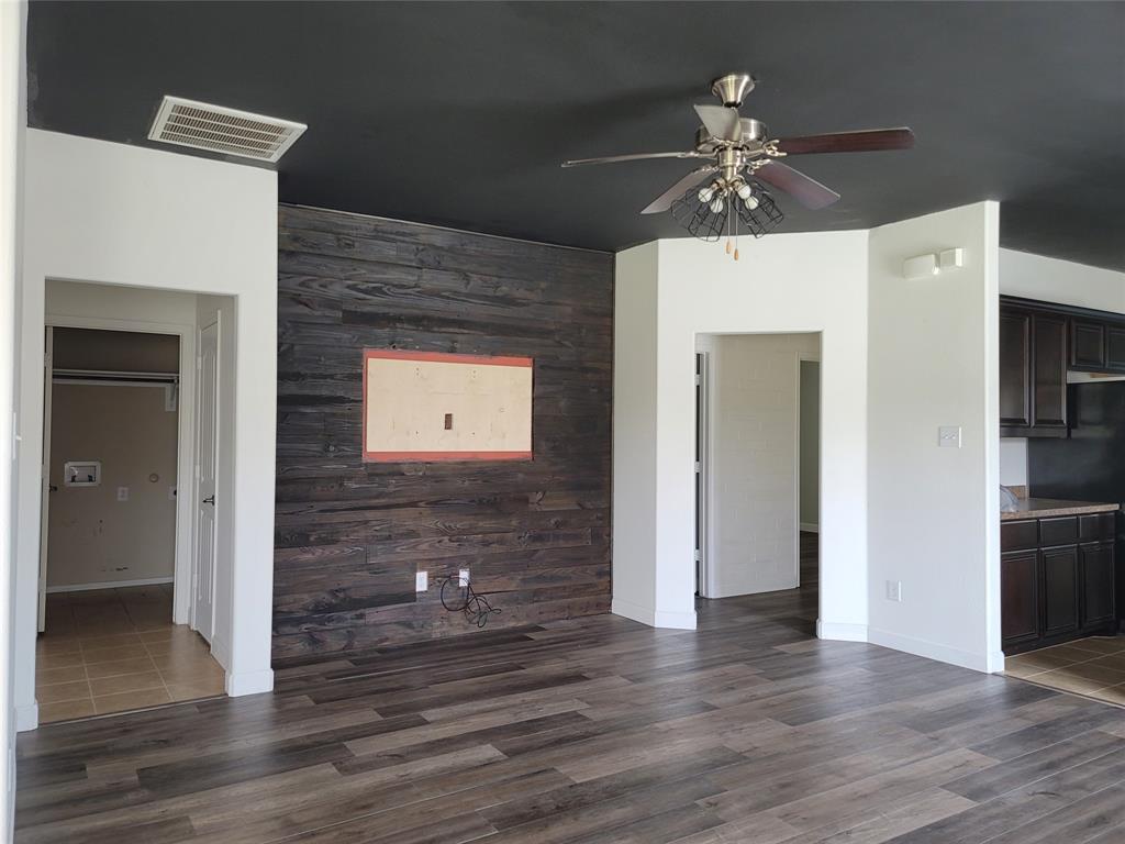 121 Chalk Road Anna, TX 75409 - Photo 13 of 22 a view of a hallway with wooden floor and entryway