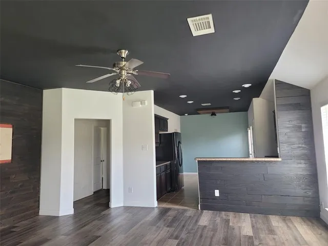 a view of a livingroom with a kitchen