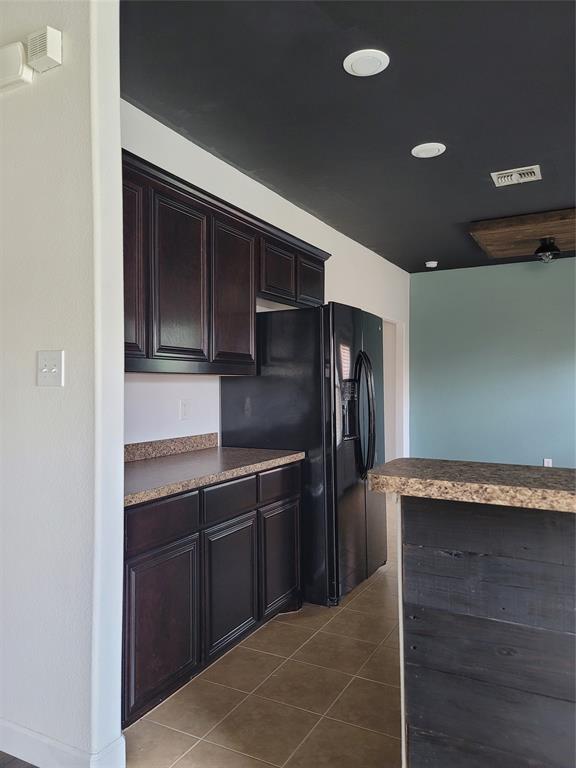 121 Chalk Road Anna, TX 75409 - Photo 16 of 22 a kitchen with granite countertop cabinets and refrigerator