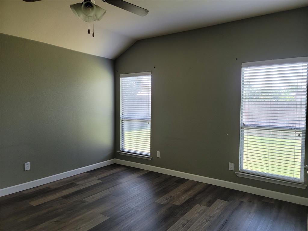 121 Chalk Road Anna, TX 75409 - Photo 19 of 22 an empty room with wooden floor and windows