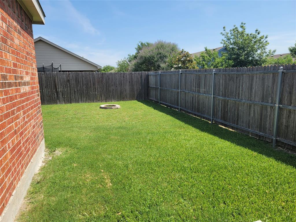 121 Chalk Road Anna, TX 75409 - Photo 20 of 22 a view of a backyard with a garden