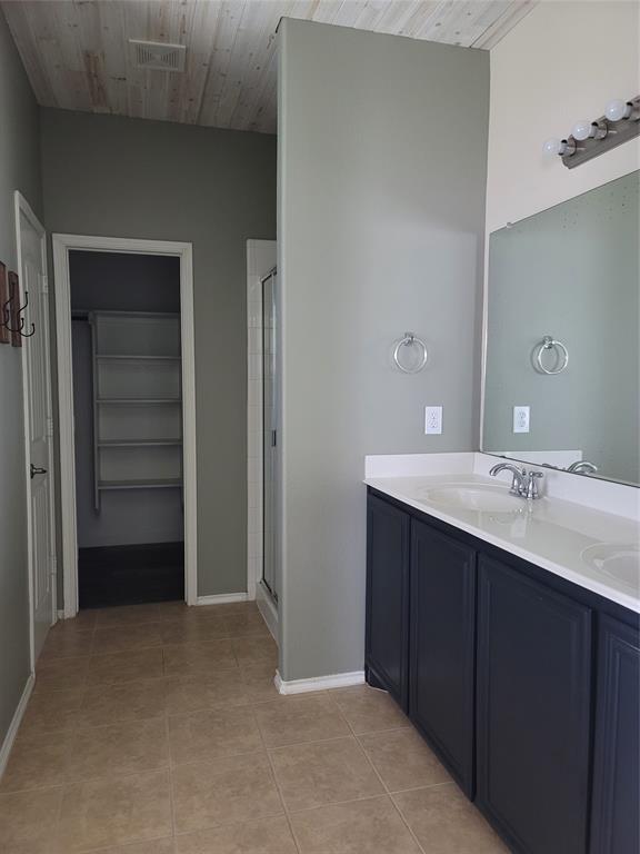 121 Chalk Road Anna, TX 75409 - Photo 3 of 22 a bathroom with a double vanity sink and mirror