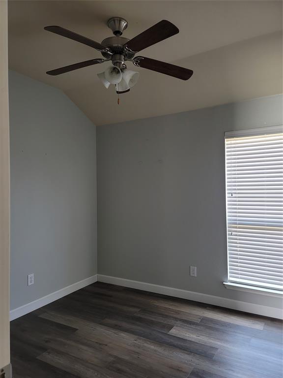 121 Chalk Road Anna, TX 75409 - Photo 9 of 22 an empty room with wooden floor chandelier fan and windows