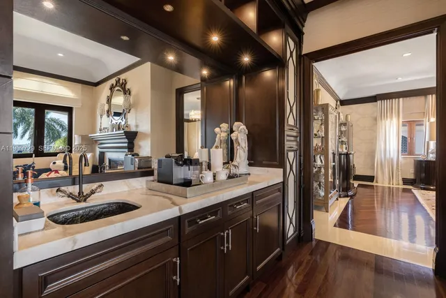 a spacious bathroom with a tub sink and mirror