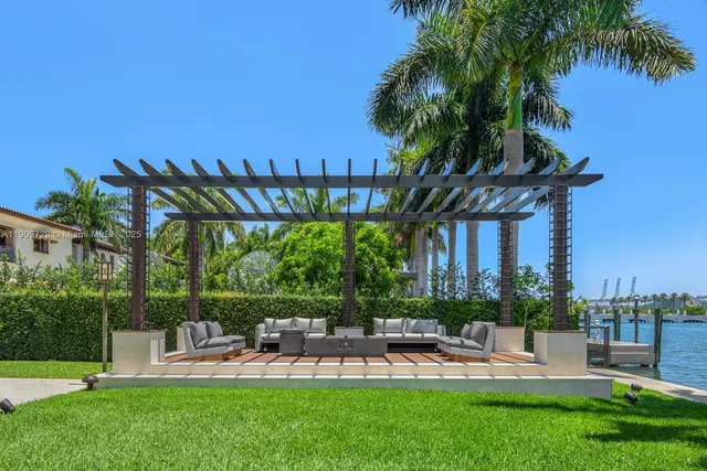 a view of a yard with a table and chairs