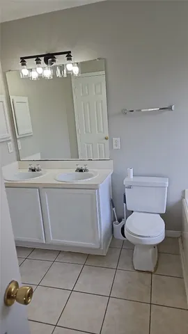 a bathroom with a toilet and a sink