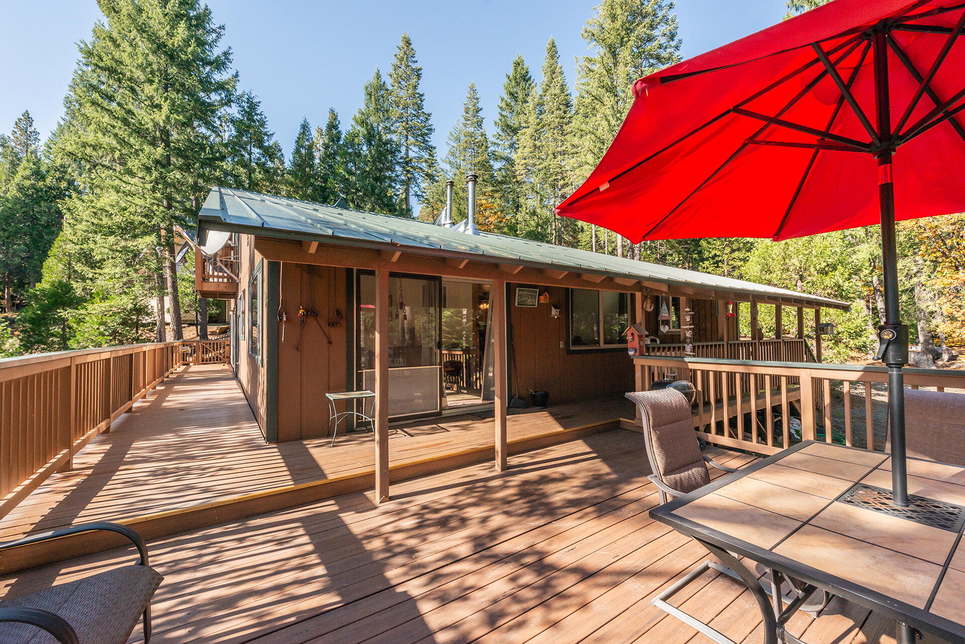 851 Mountain Aire Road Trinity Center, CA 96091 - Photo 5 of 54 a view of a chair and table on the deck