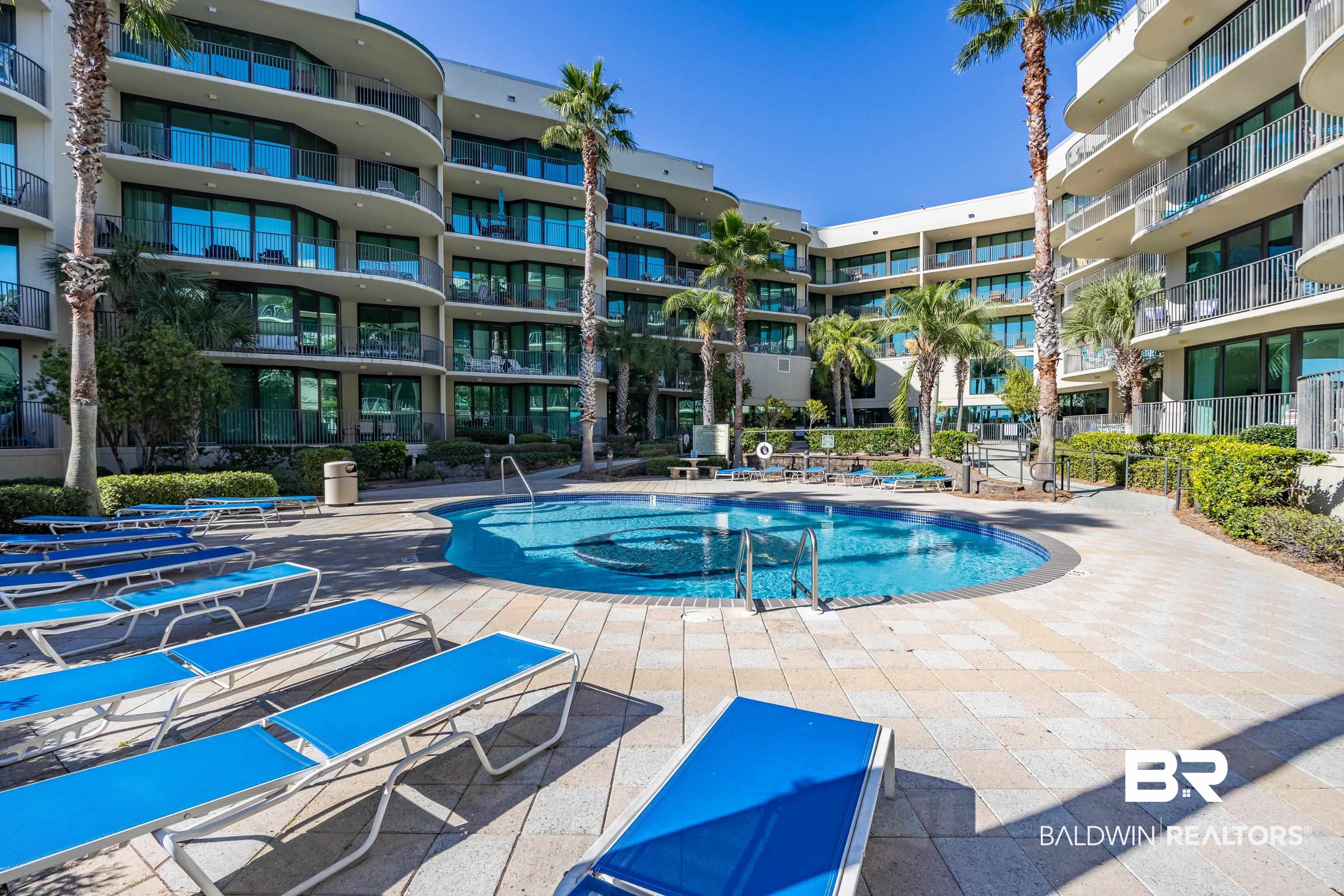 27580 Canal Road, Unit 1431 Orange Beach, AL 36561 - Photo 64 of 73 Community pool with a patio