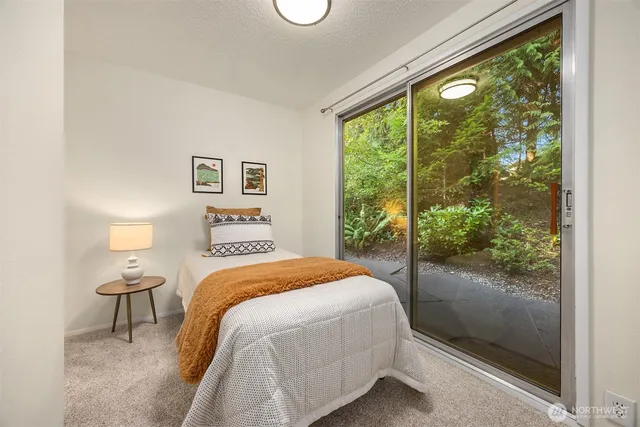 a bedroom with a balcony and a bed