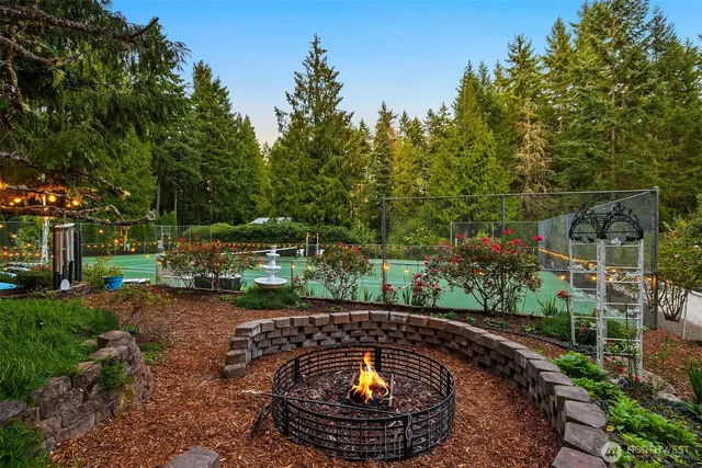 a view of a swimming pool with a patio and a garden