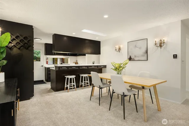a view of a livingroom with furniture and a flat screen tv