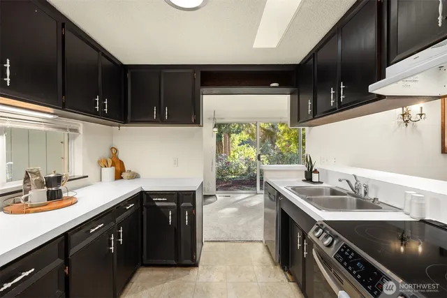 a kitchen with a sink and cabinets