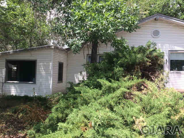571 29 Road Grand Junction, CO 81501 - Photo 6 of 19 a view of a house with a yard and tree s