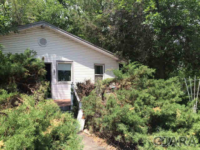 571 29 Road Grand Junction, CO 81501 - Photo 7 of 19 a view of a house with a yard and potted plants
