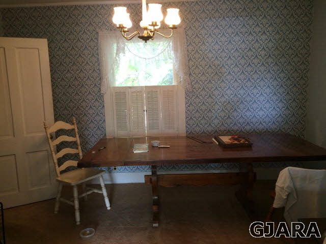 571 29 Road Grand Junction, CO 81501 - Photo 8 of 19 a view of a dining room with furniture and chandelier