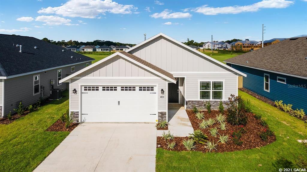 1394 Southwest 68th Terrace Gainesville, FL 32607 - Photo 1 of 1 a view of a house with backyard