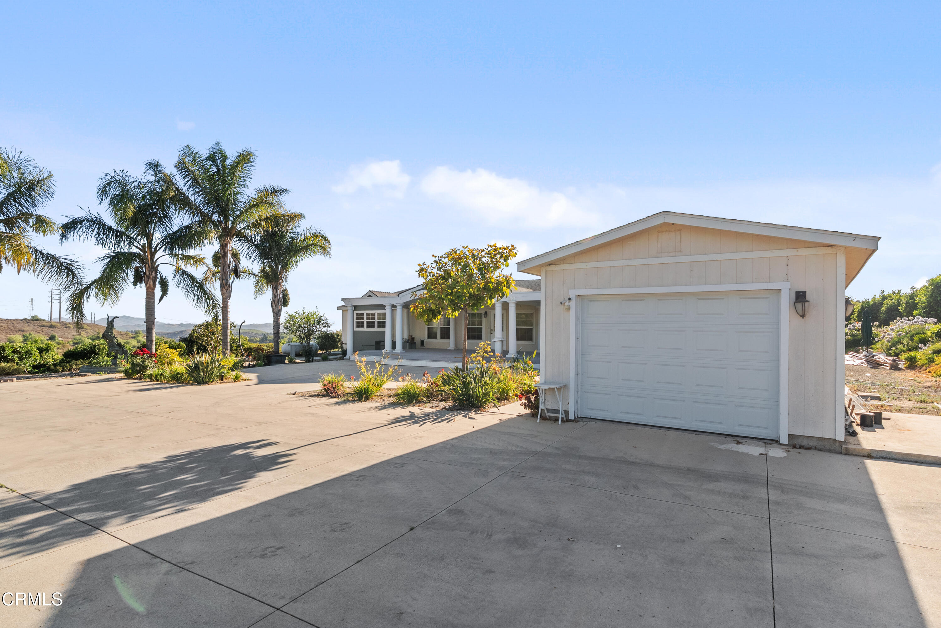 11972 Broadway Road Moorpark, CA 93021 - Photo 5 of 9 front view of a house with a yard and a car parked