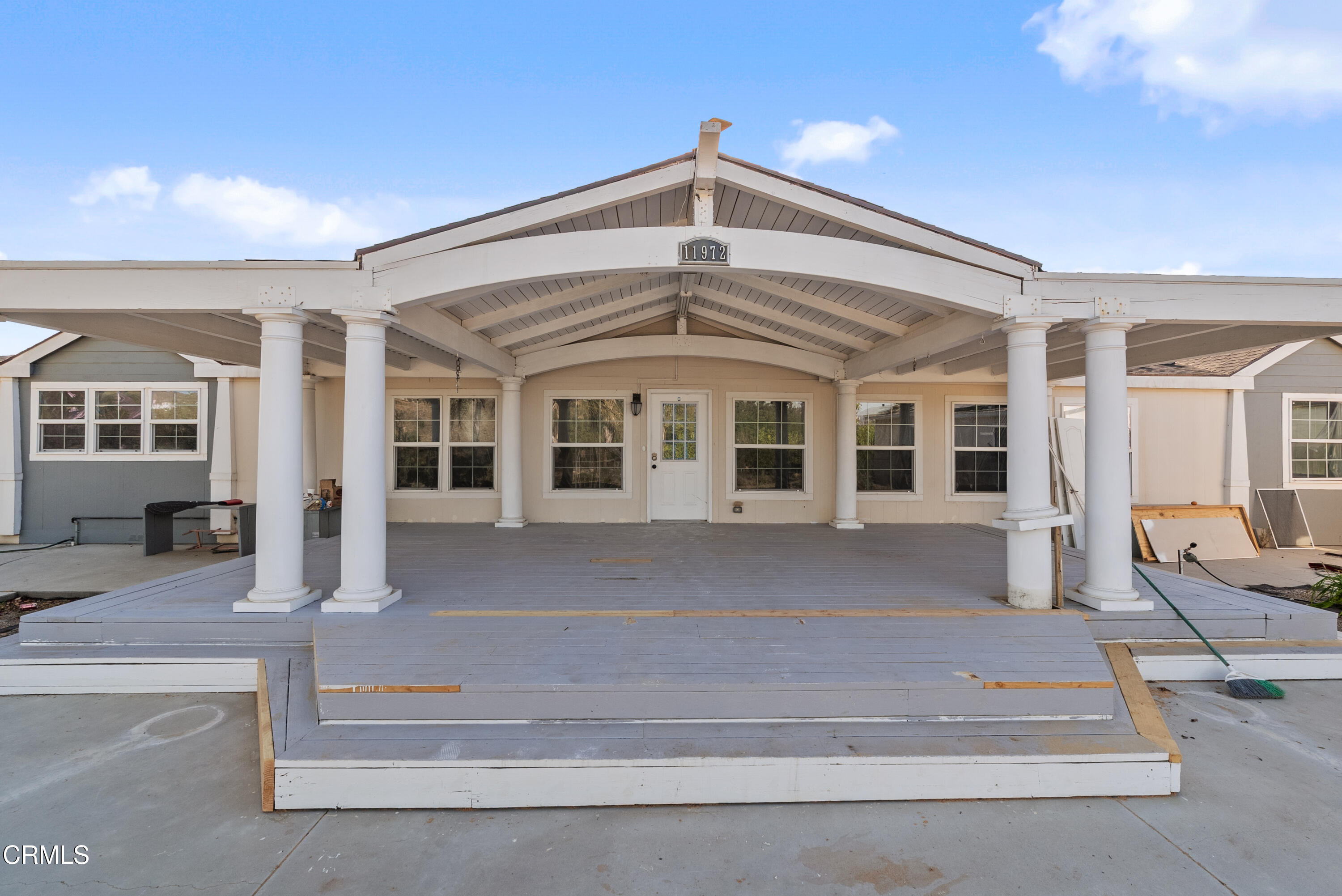 11972 Broadway Road Moorpark, CA 93021 - Photo 8 of 9 a front view of a house with a porch