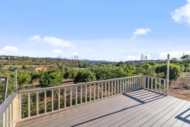 a view of wooden deck and city view