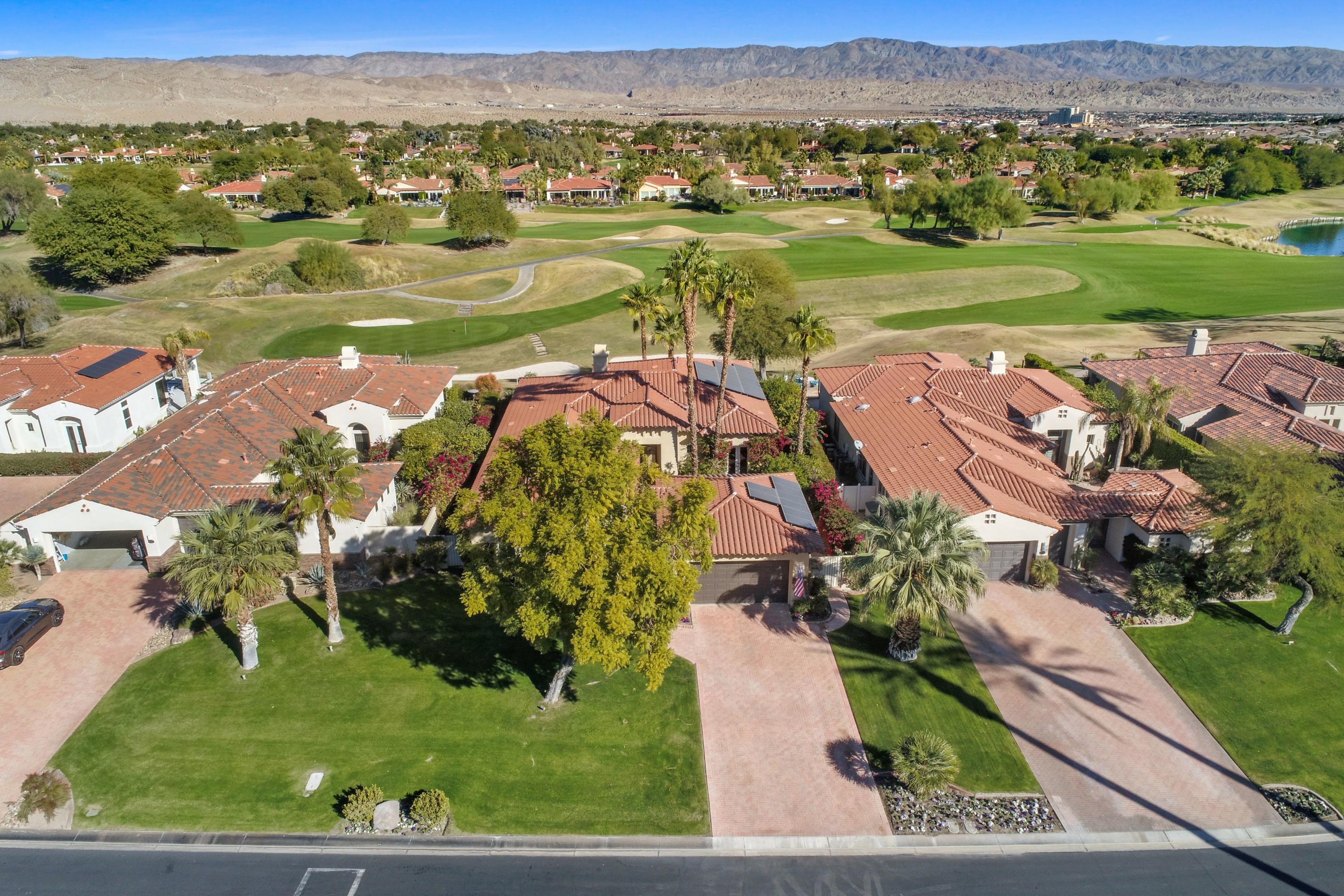 122 Loch Lomond Road Rancho Mirage, CA 92270 - Photo 1 of 34 an aerial view of a houses with a lake view
