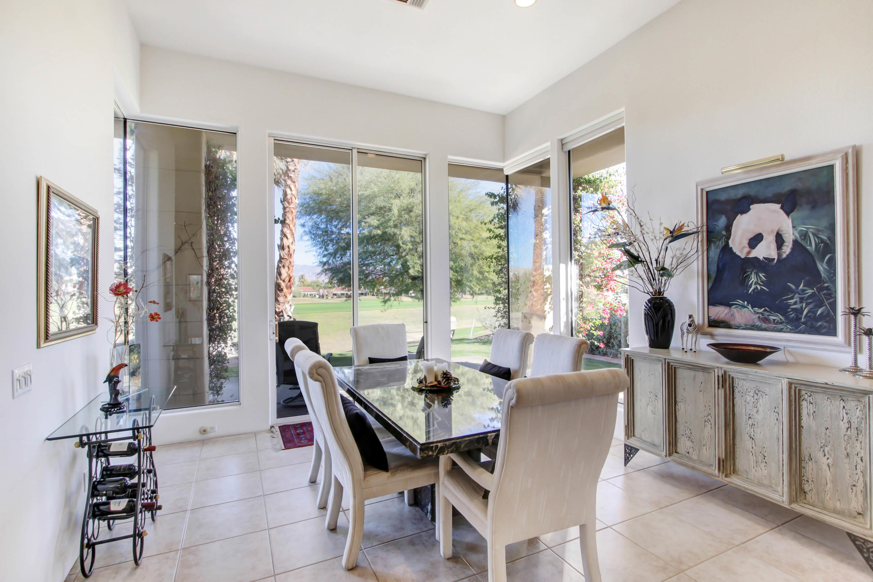 122 Loch Lomond Road Rancho Mirage, CA 92270 - Photo 13 of 34 a dining room with furniture and a large window