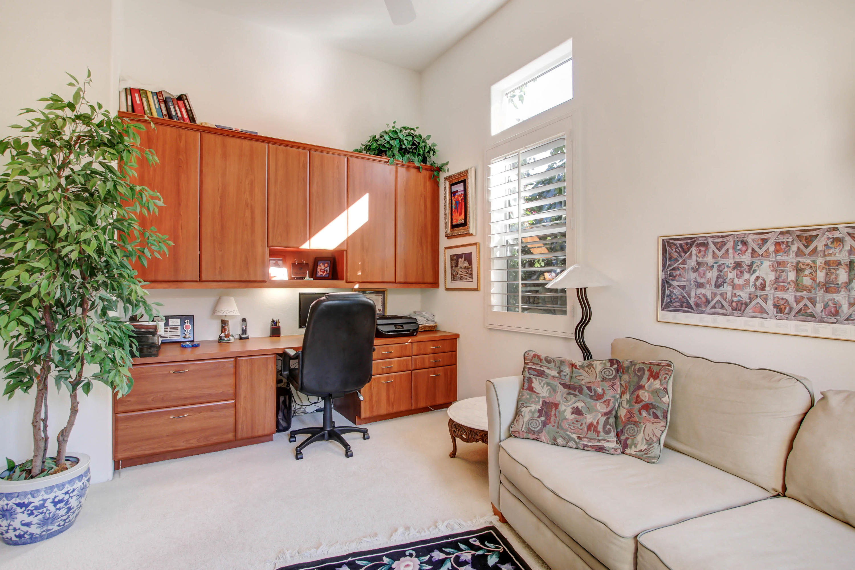 122 Loch Lomond Road Rancho Mirage, CA 92270 - Photo 14 of 34 a work room with furniture and a potted plant
