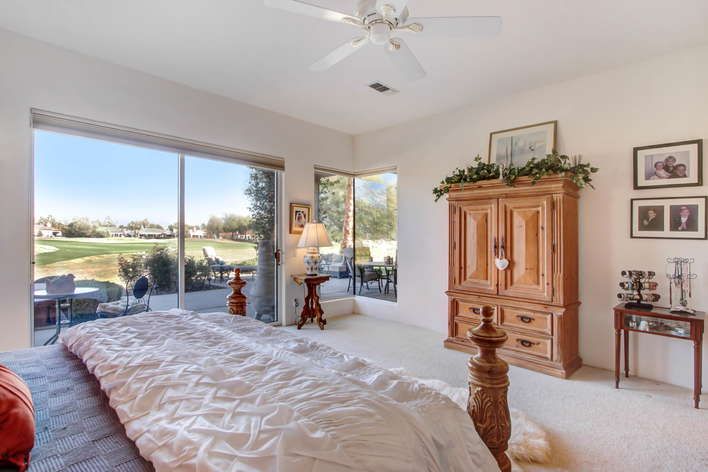 122 Loch Lomond Road Rancho Mirage, CA 92270 - Photo 16 of 34 a bed room with a bed and a large window