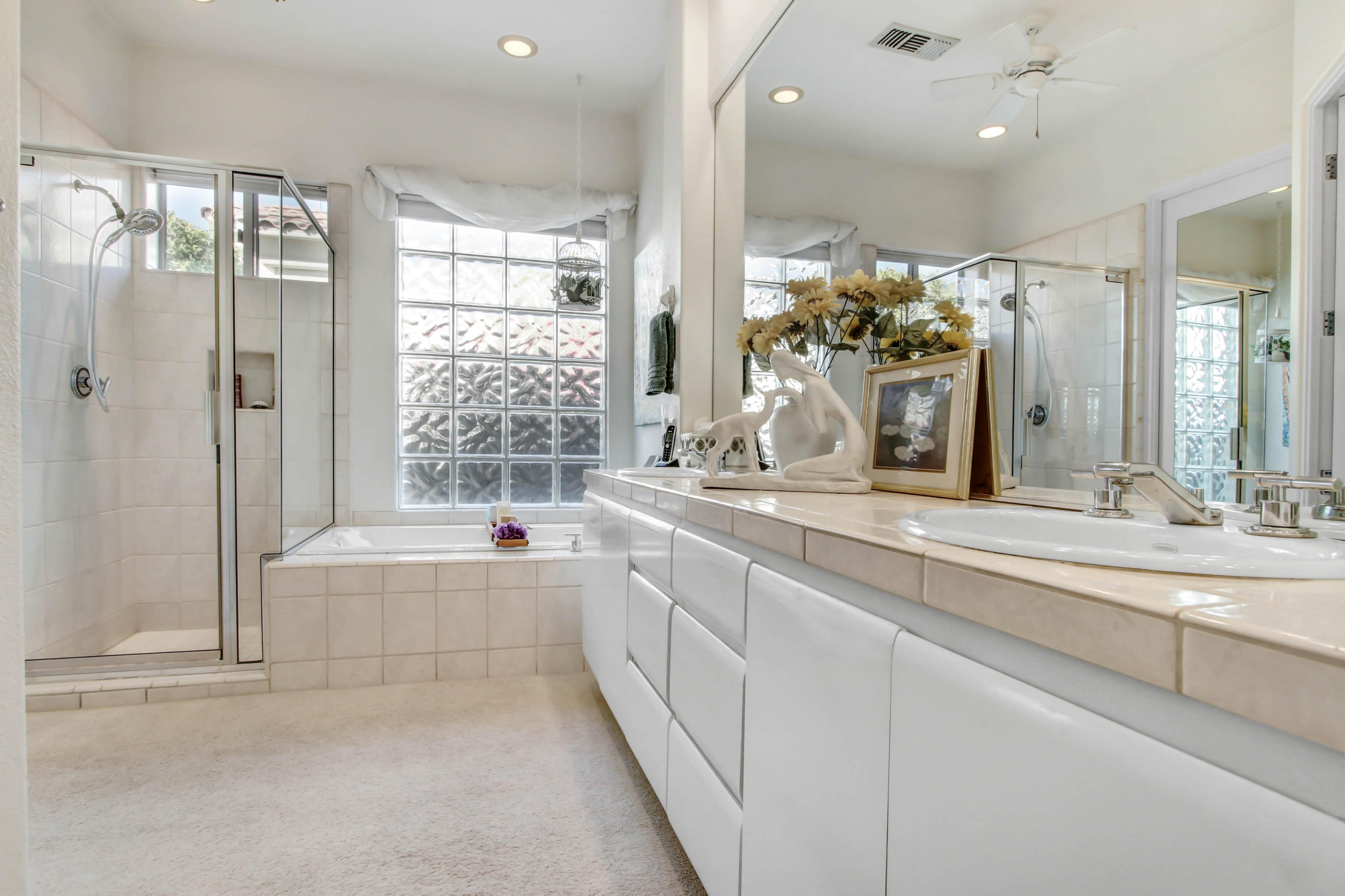 122 Loch Lomond Road Rancho Mirage, CA 92270 - Photo 17 of 34 a large white bathroom with a large tub and shower
