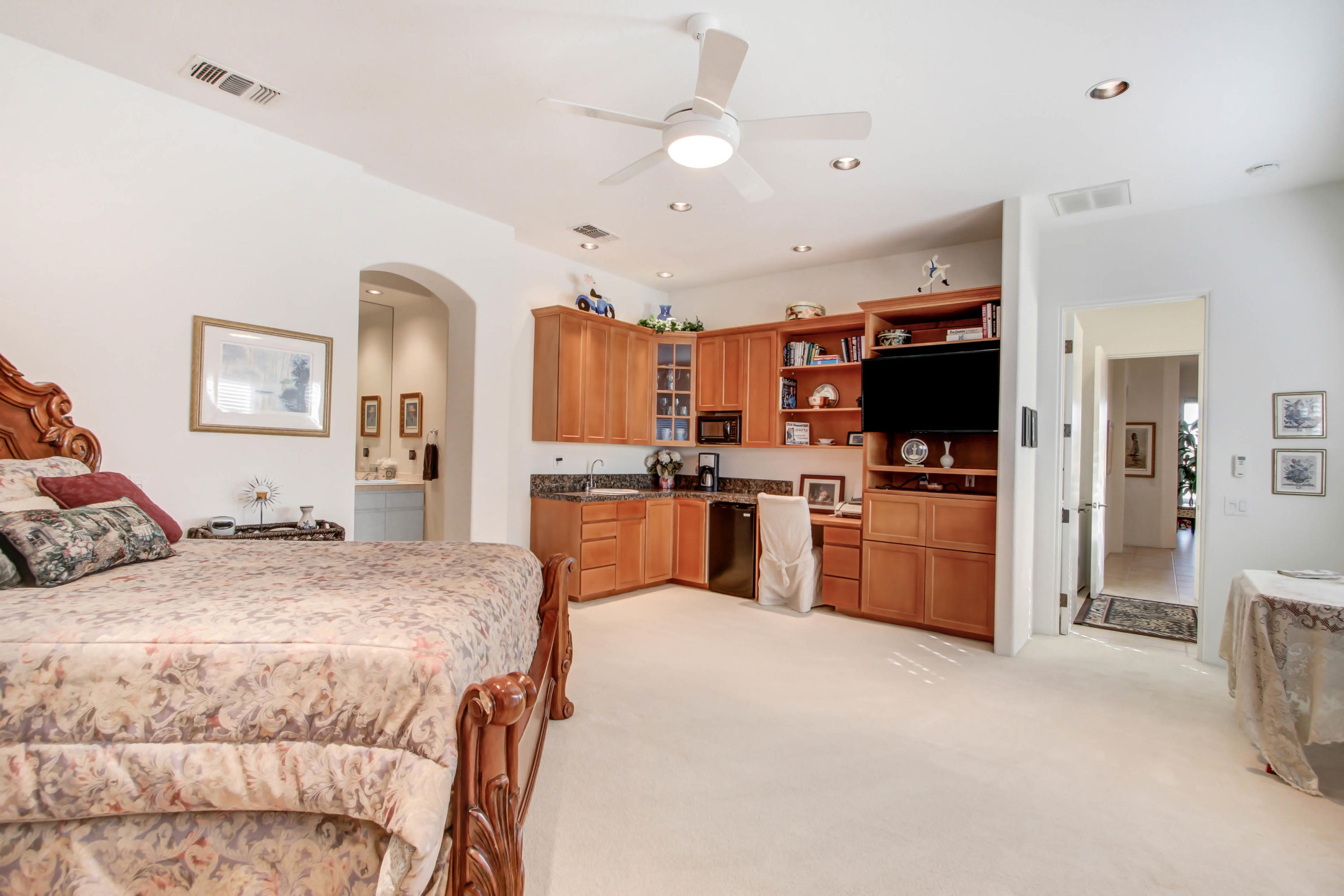 122 Loch Lomond Road Rancho Mirage, CA 92270 - Photo 18 of 34 a bed room with a bed and a television