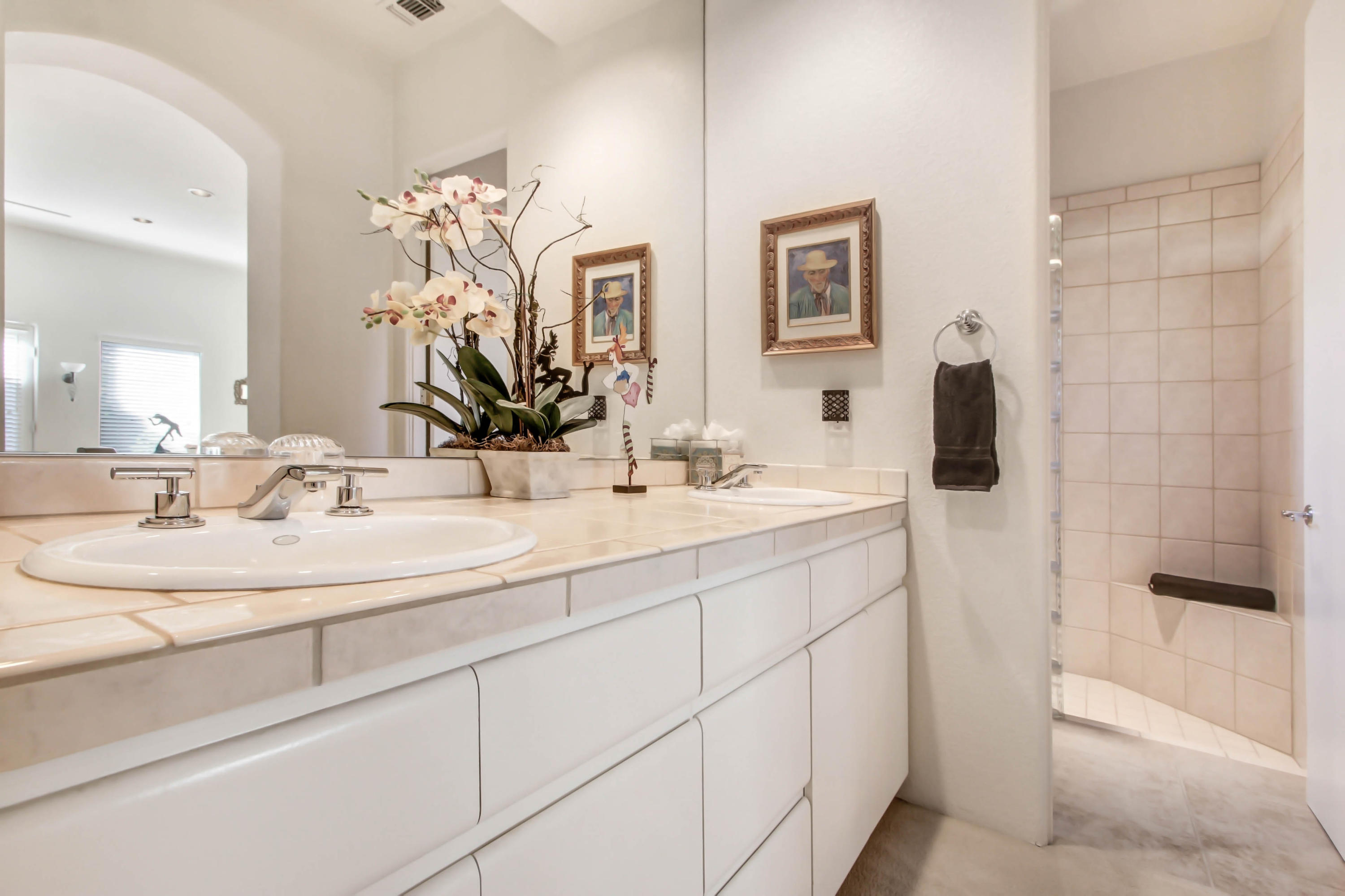 122 Loch Lomond Road Rancho Mirage, CA 92270 - Photo 19 of 34 a bathroom with a sink and a mirror