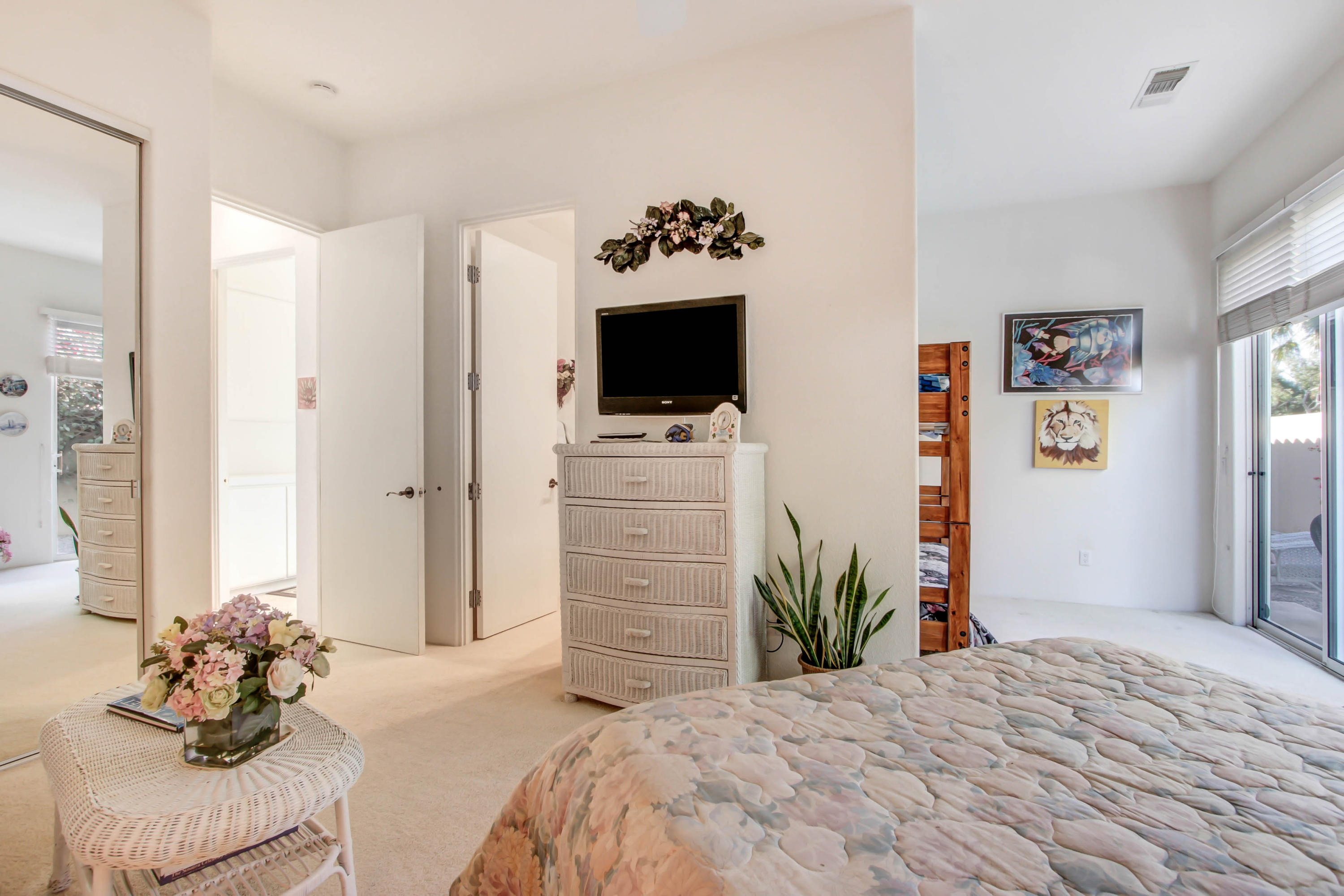 122 Loch Lomond Road Rancho Mirage, CA 92270 - Photo 20 of 34 a bedroom with a bed and a flat screen tv