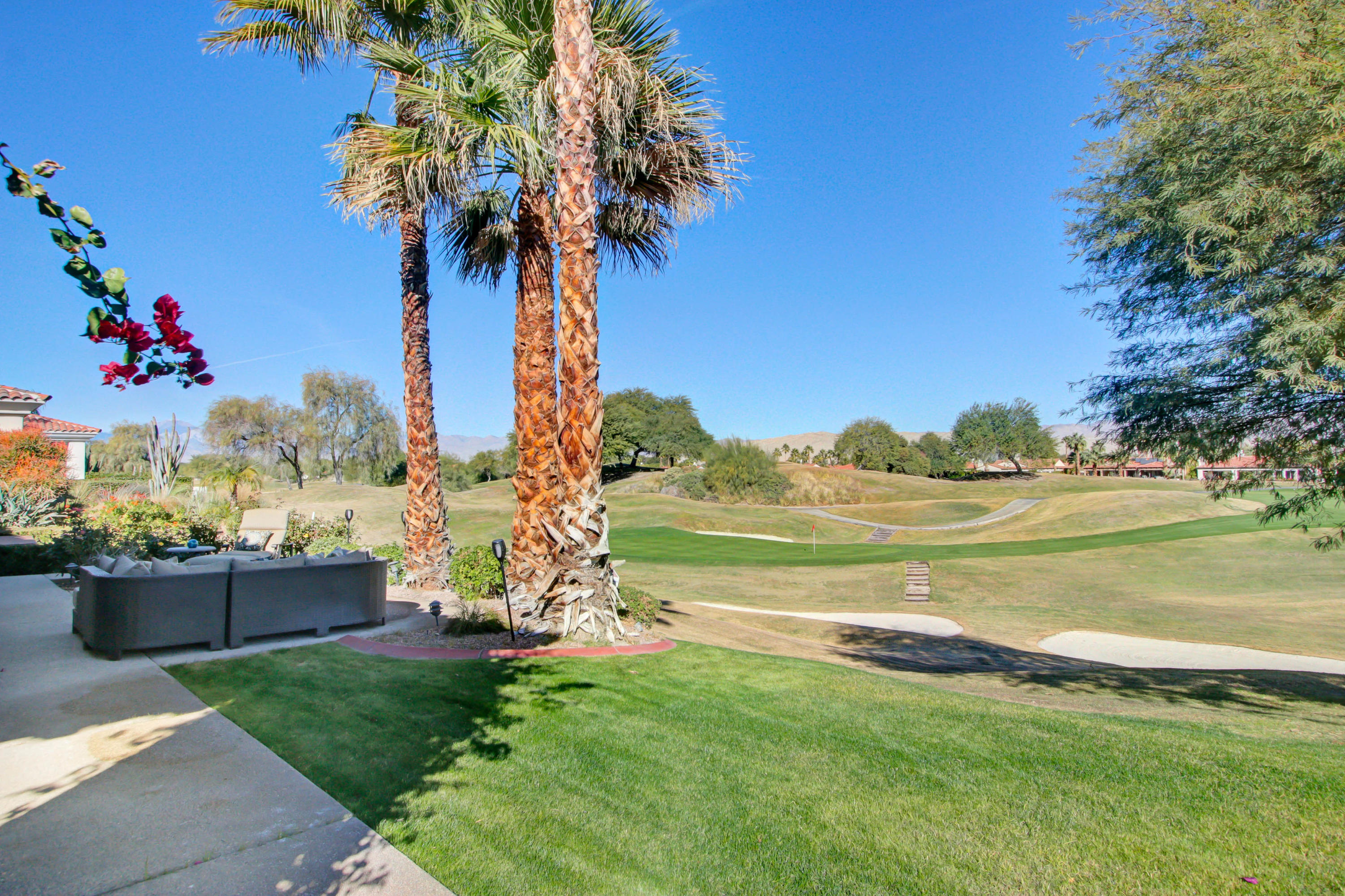 122 Loch Lomond Road Rancho Mirage, CA 92270 - Photo 23 of 34 a view of a garden with an ocean