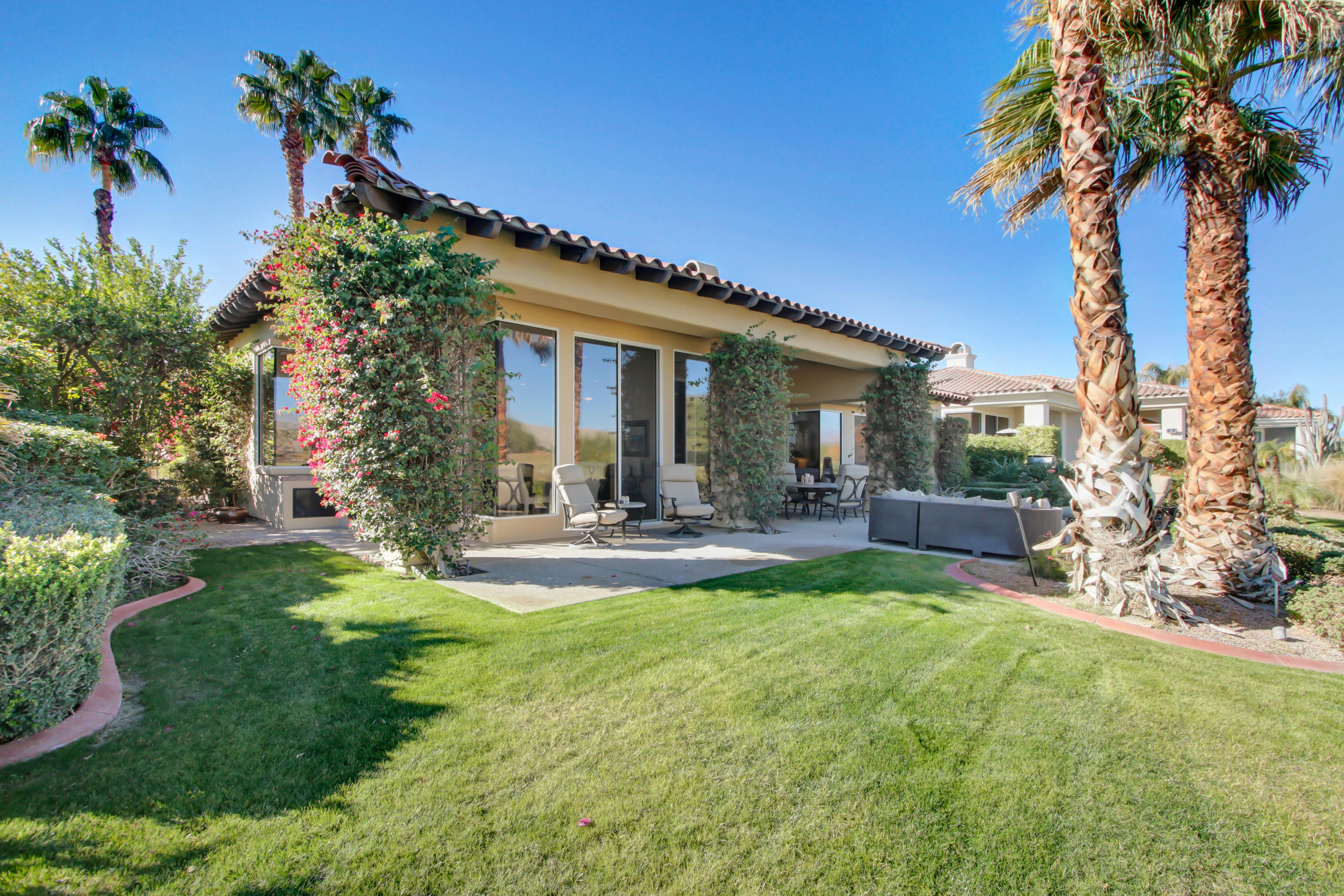122 Loch Lomond Road Rancho Mirage, CA 92270 - Photo 25 of 34 a view of a house with swimming pool and sitting area