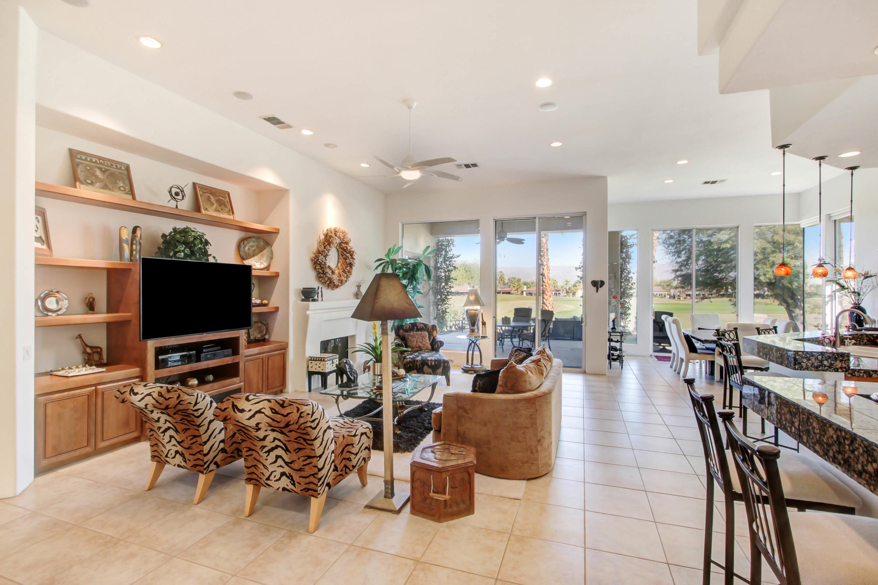 122 Loch Lomond Road Rancho Mirage, CA 92270 - Photo 8 of 34 a living room with furniture and a flat screen tv