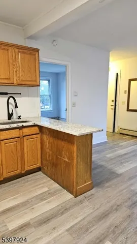 a kitchen with wooden cabinets