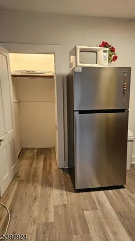 a white refrigerator freezer sitting in a kitchen