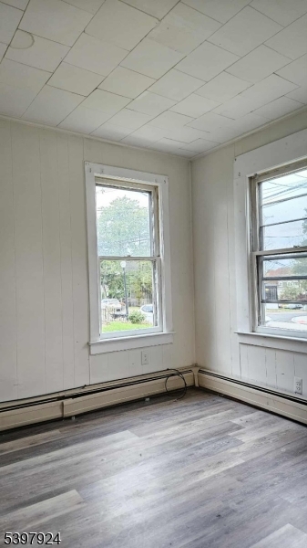 16 Main Street, Unit A Netcong, NJ 07857 - Photo 9 of 12 an empty room with wooden floor and windows