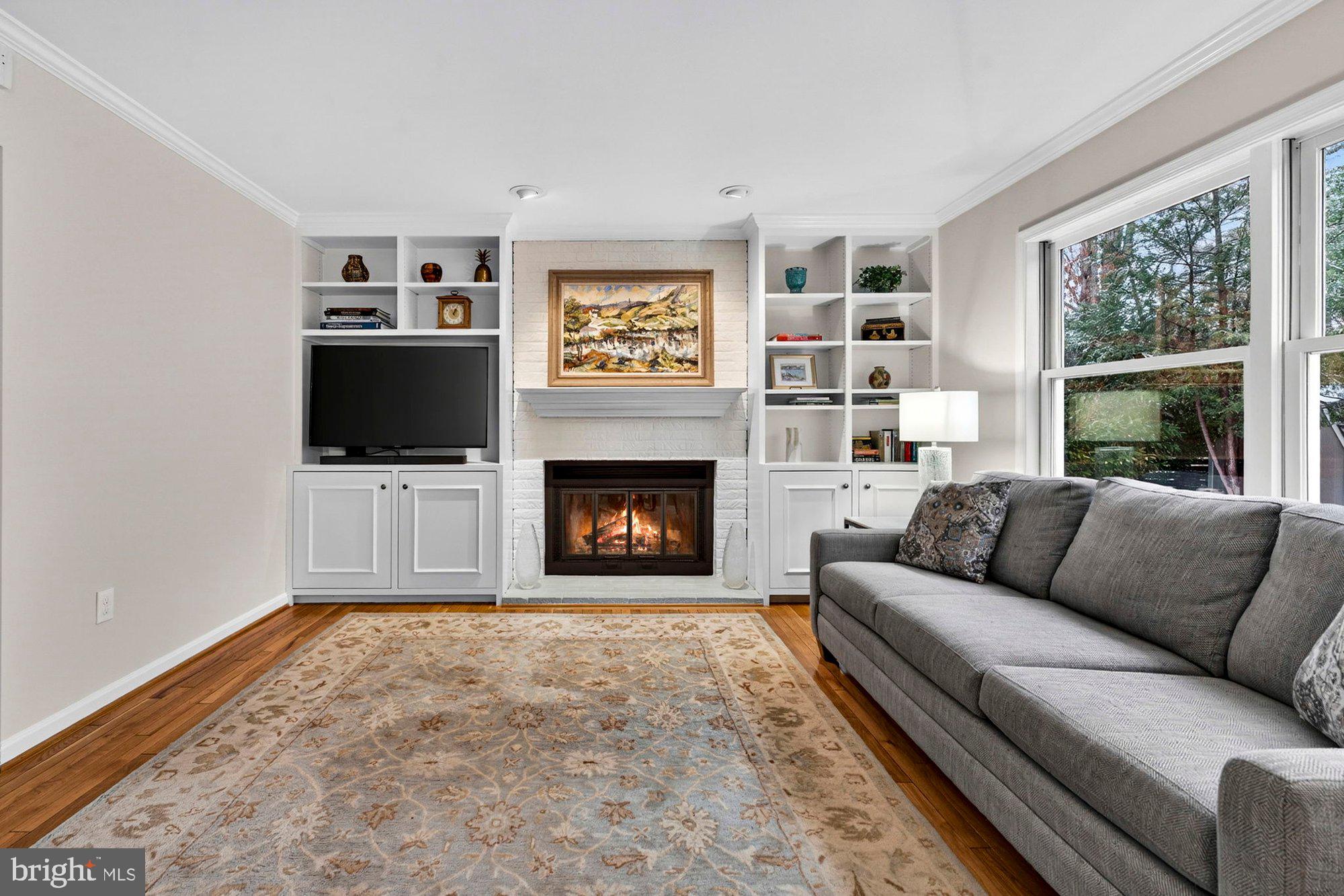 930 Park Street Vienna, VA 22180 - Photo 29 of 83 a living room with furniture a flat screen tv and a fireplace