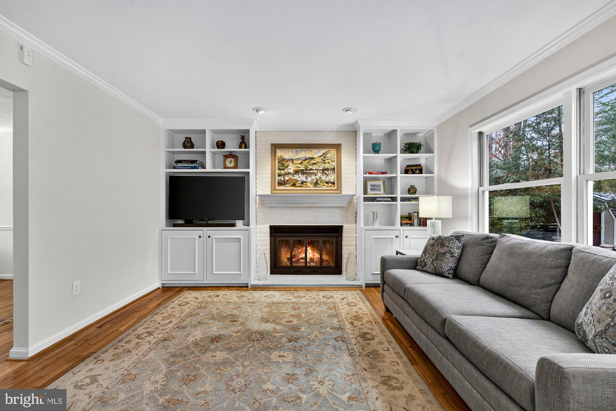 930 Park Street Vienna, VA 22180 - Photo 30 of 83 a living room with furniture a flat screen tv and a fireplace