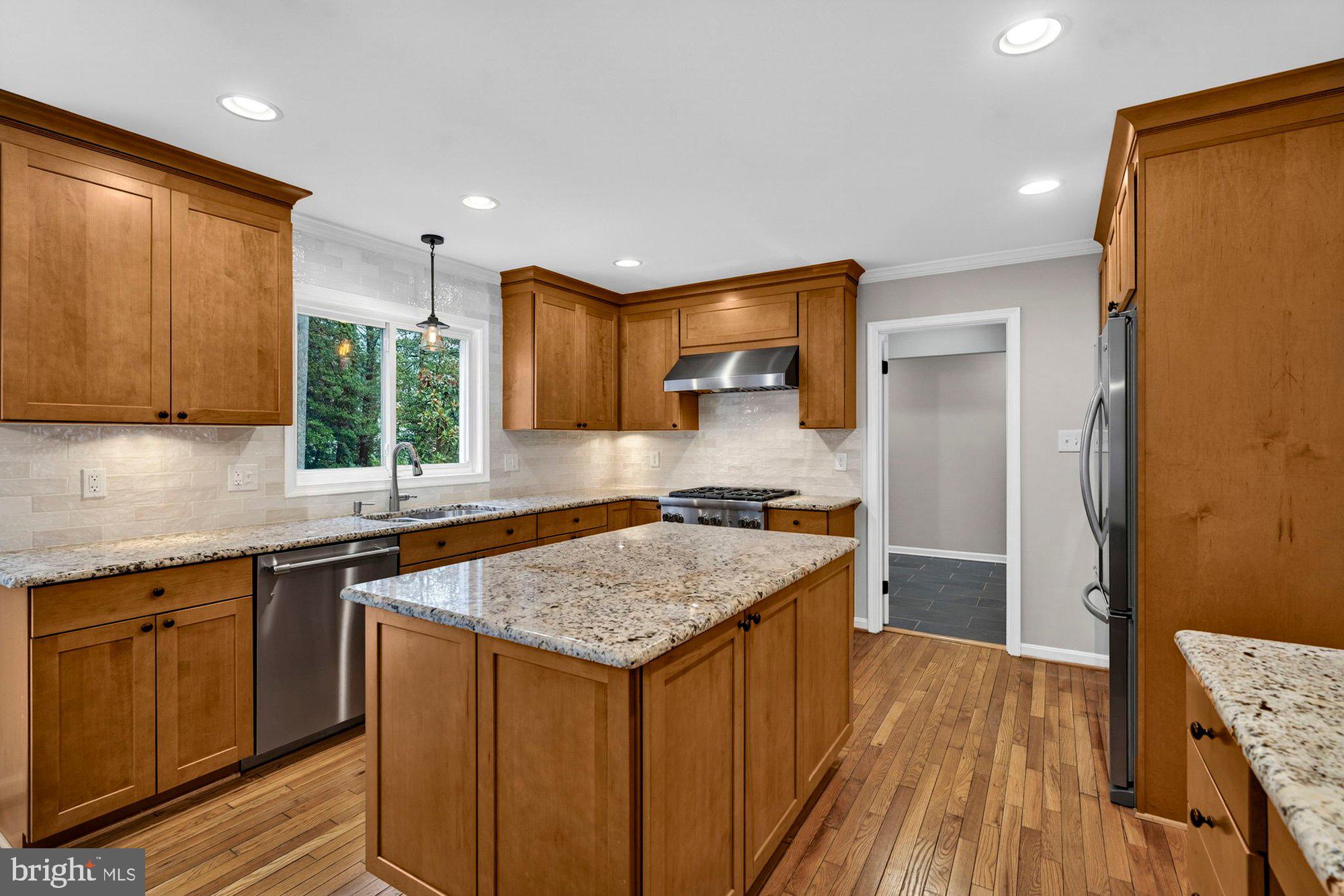 930 Park Street Vienna, VA 22180 - Photo 3 of 83 a kitchen with stainless steel appliances granite countertop a sink stove and refrigerator