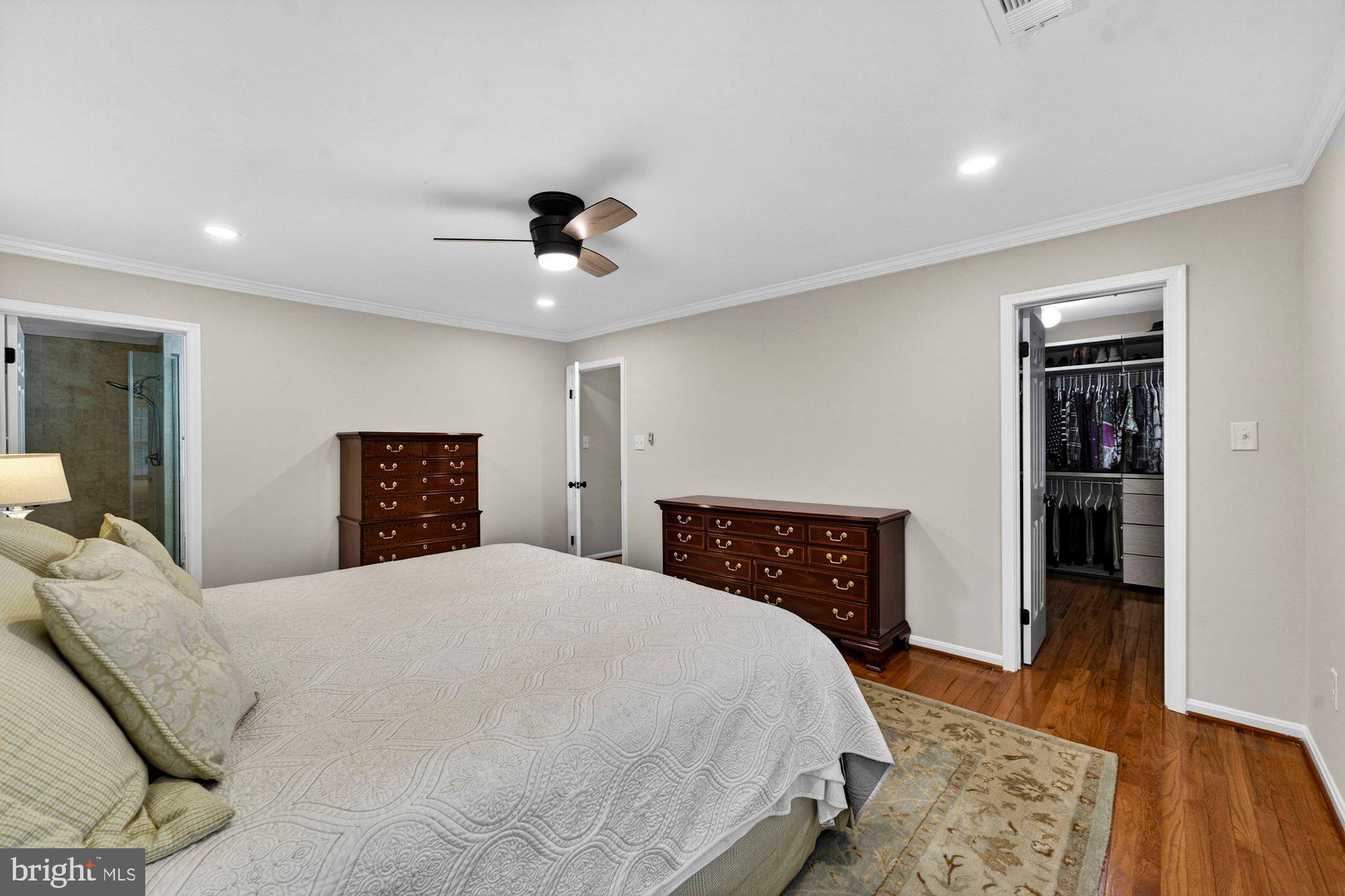930 Park Street Vienna, VA 22180 - Photo 41 of 83 a bedroom with a large bed and a wooden floor